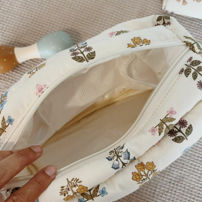 Bolsa cambiadora de muselina con estampado floral de poliéster